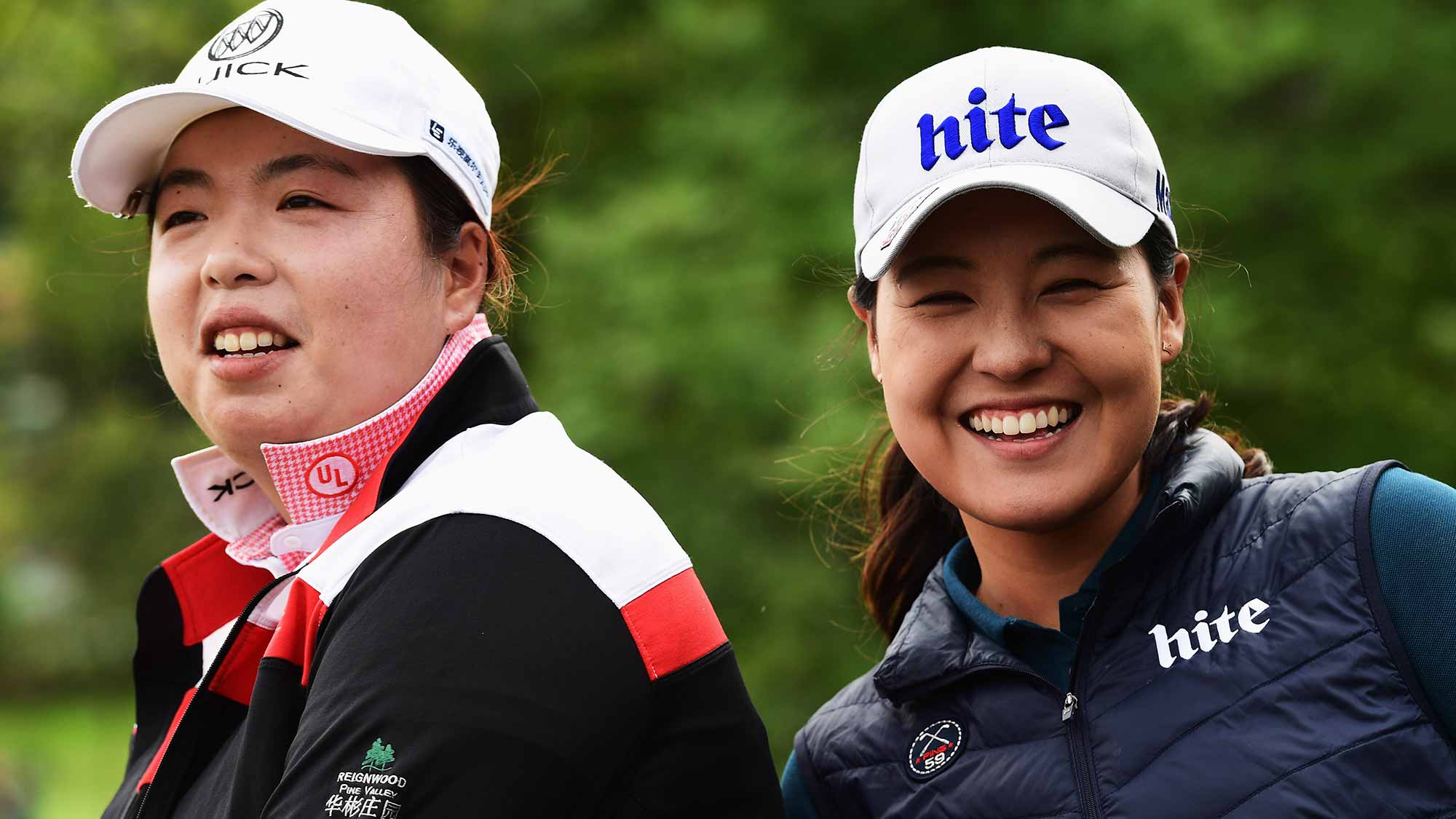 Shanshan Feng of China and In Gee Chun of Korea look on during the third round of The Evian Championship