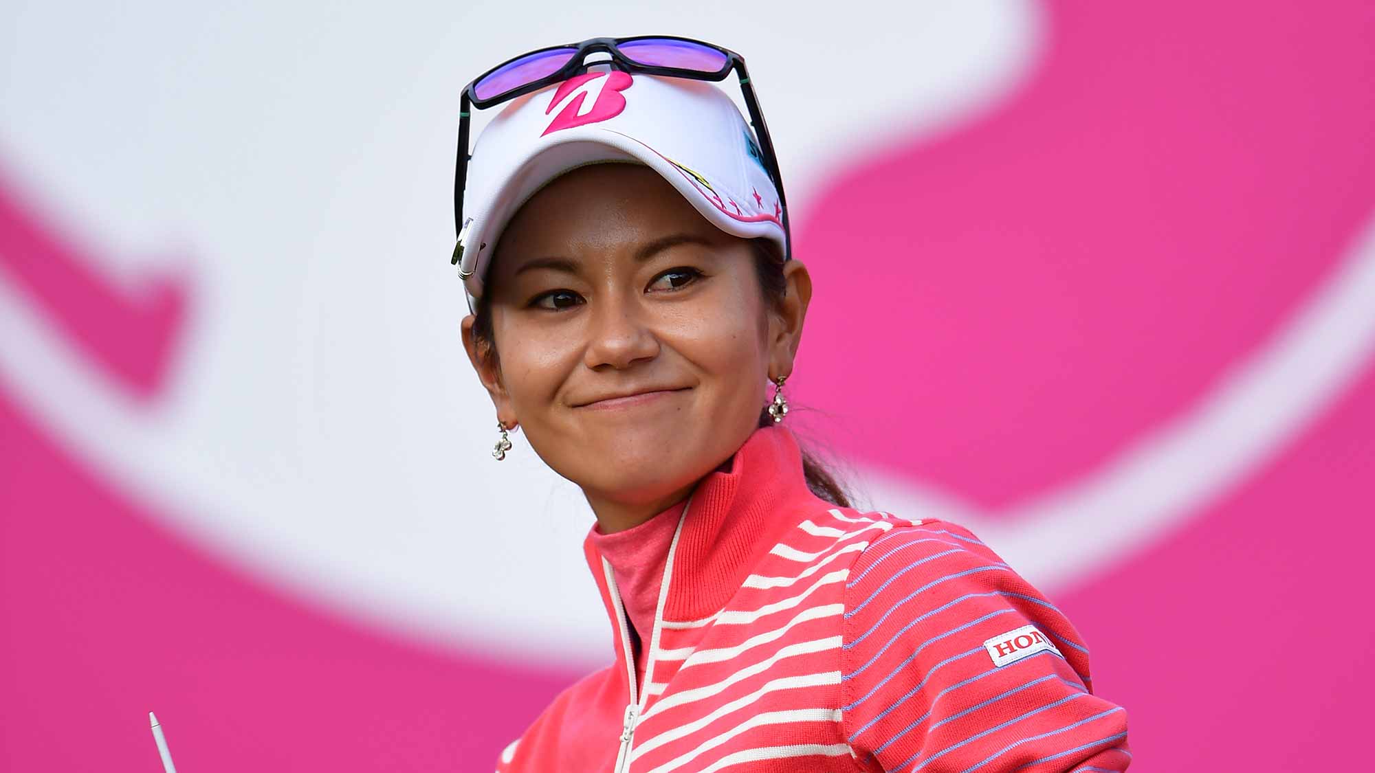 Ai Miyazato of Japan waves to fans as she makes her final competency round of golf during the final round of the Evian Championship at Evian Golf Club