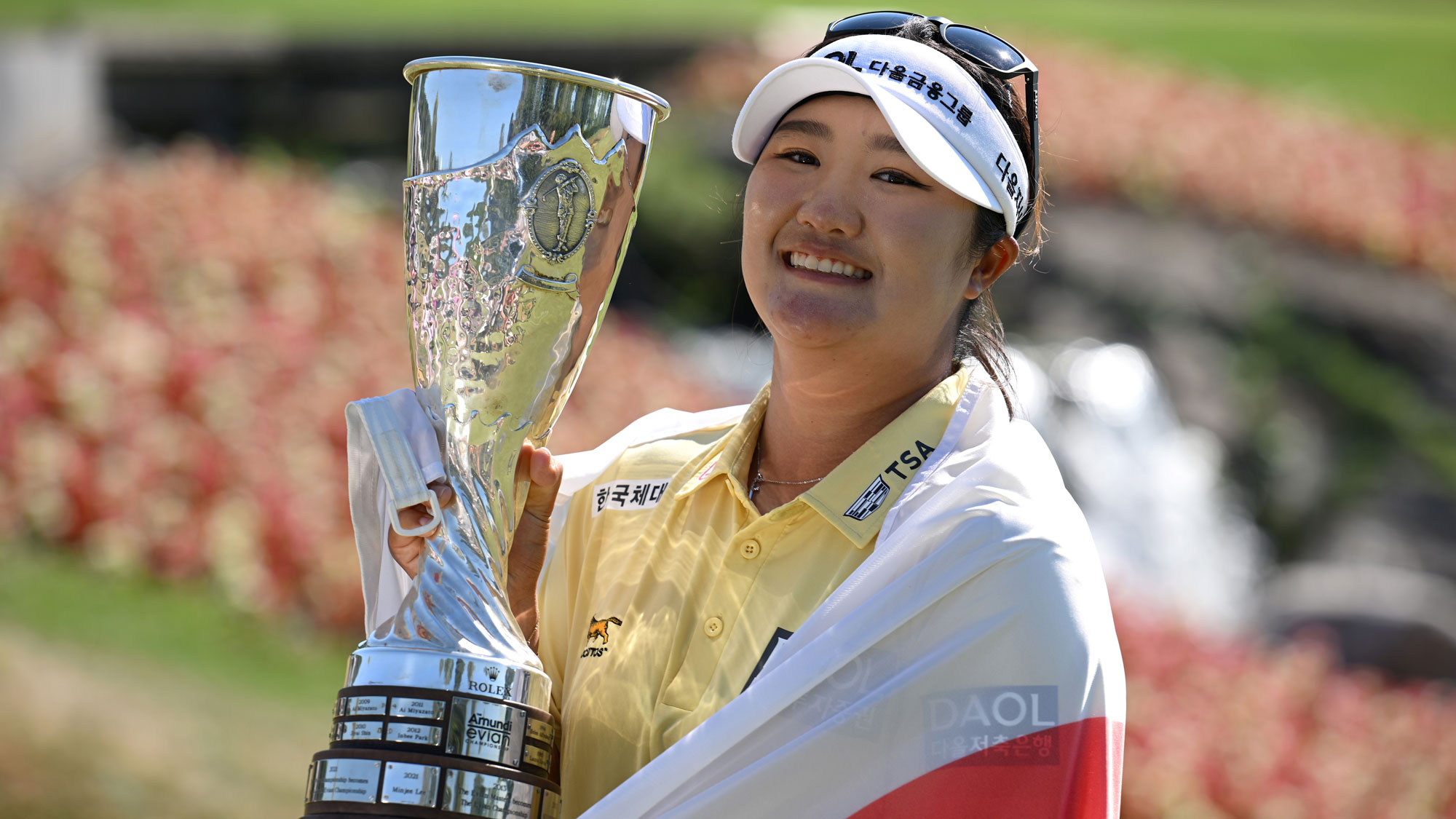 Haeran Ryu of South Korea poses for a photo with the trophy following victory during the final round of The Amundi Evian Championship 2026 at Evian Resort Golf Club on July 12, 2026 in Evian-les-Bains, France.