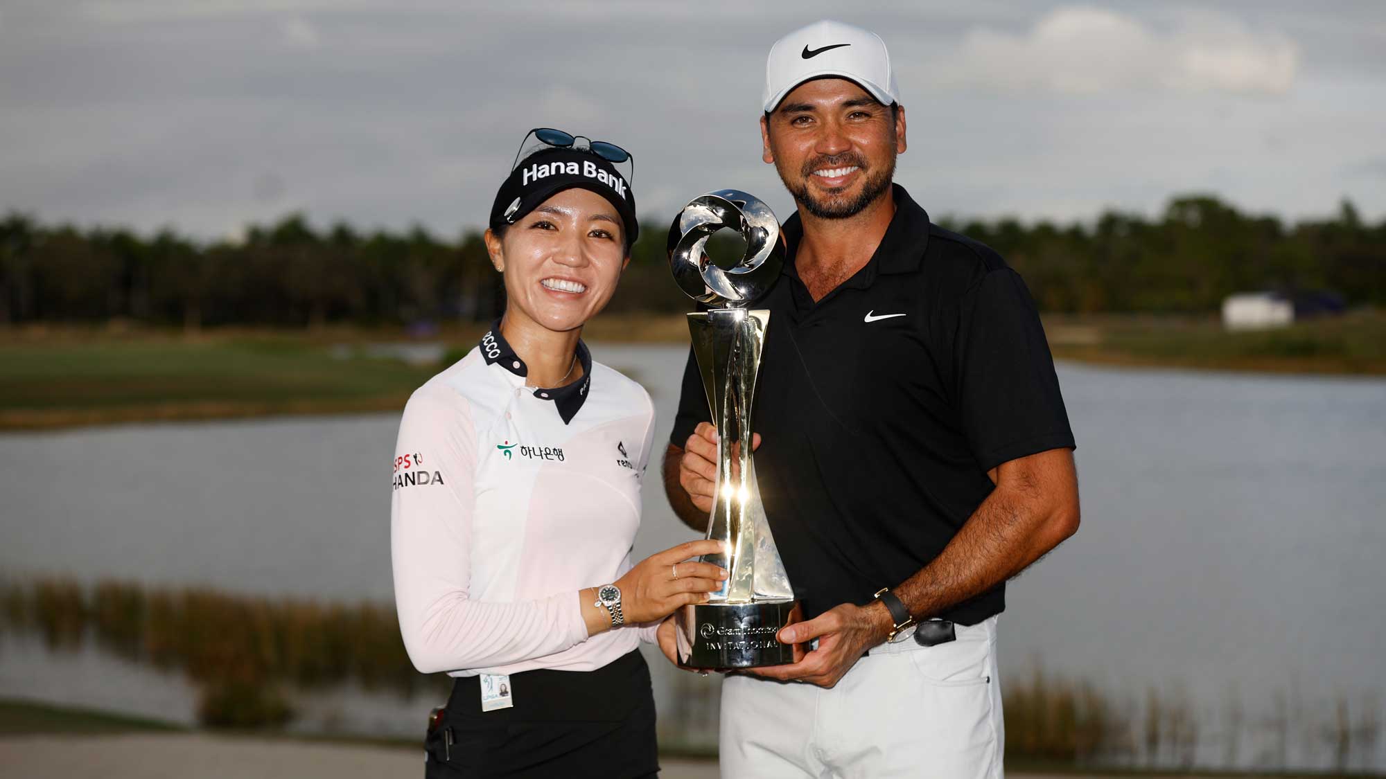 Lydia Ko and Jason Day with trophy