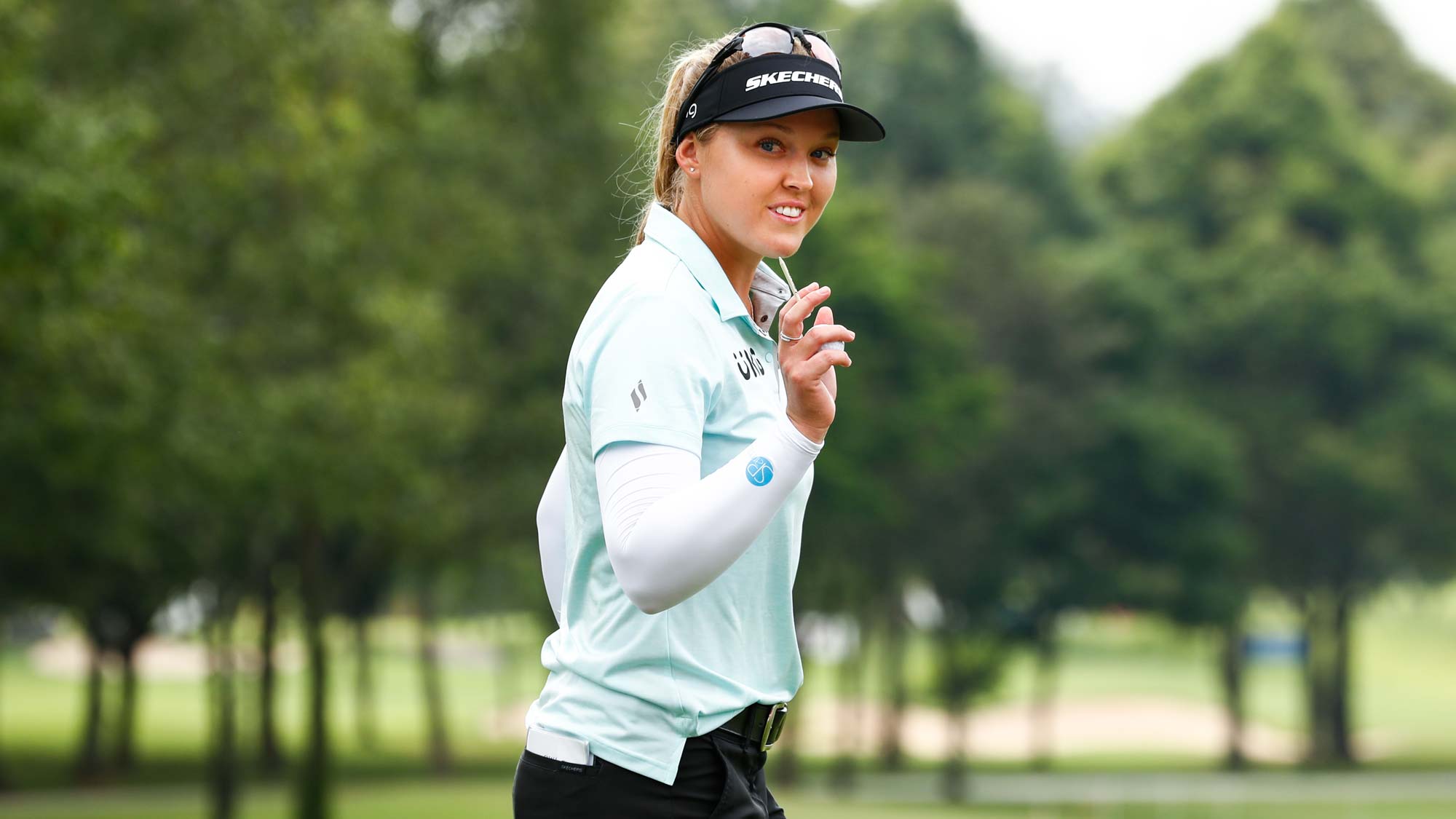 Brooke M. Henderson of Canada reacts before playing her tee shot on the 1st hole during the final round of Honda LPGA Thailand