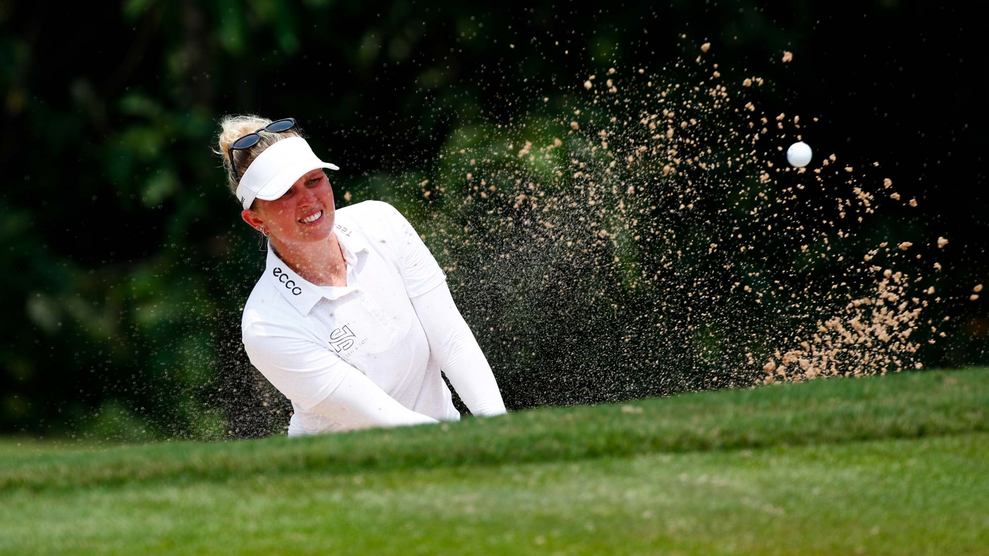 Nanna Koerstz Madsen of Denmark plays her fourth shot out of a bunker on the 7th hole during the final round of Honda LPGA Thailand