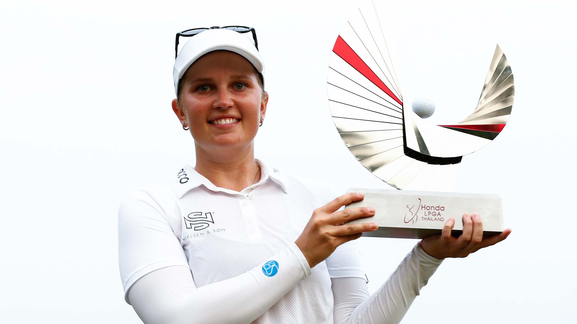 Nanna Koerstz Madsen of Denmark poses with the trophy on the 18th green after winning the final round of Honda LPGA Thailand