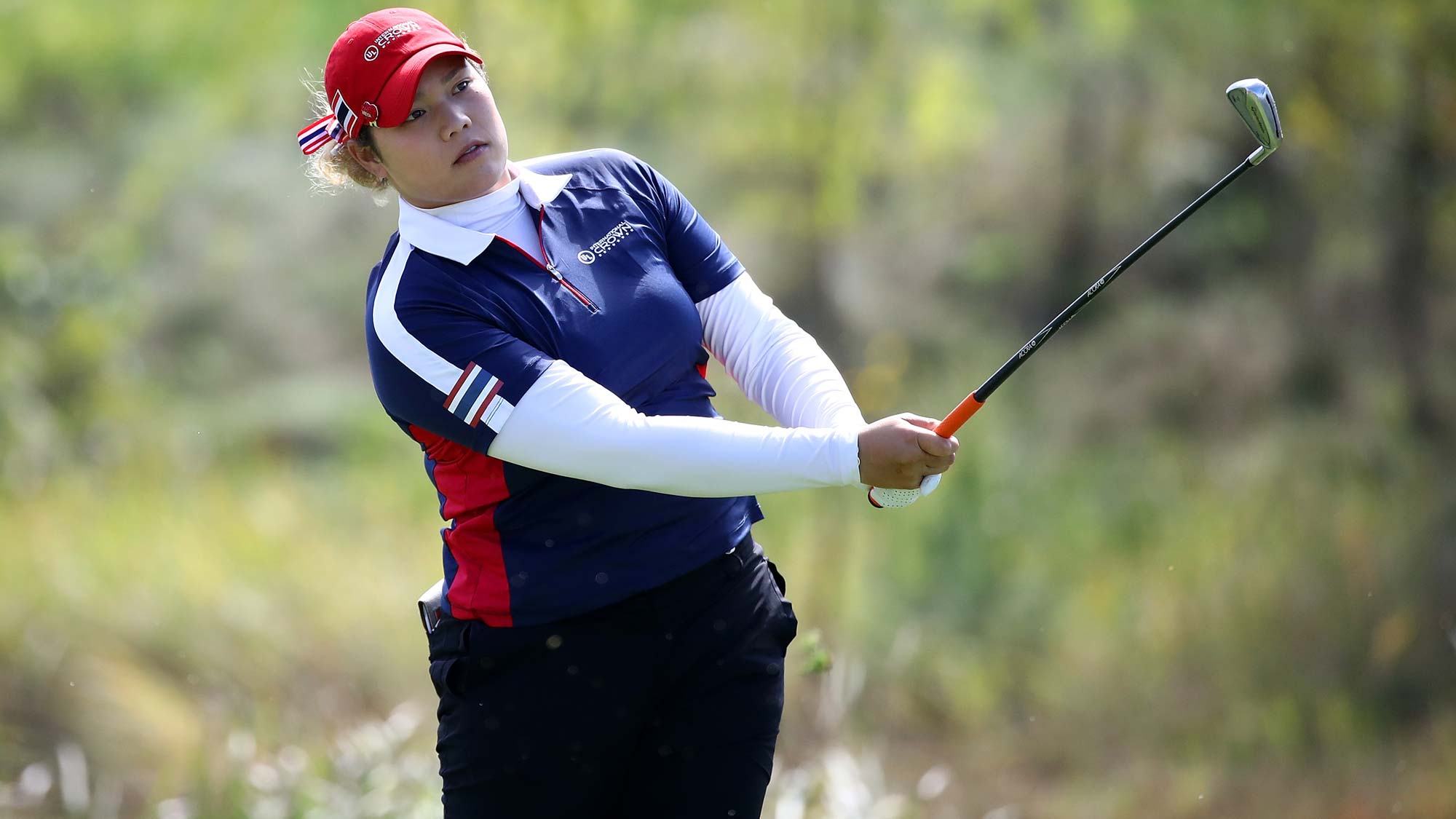 Ariya Jutanugarn of Thailand hits a tee shot on the 4th hole during the Singles match against Sung Hyun Park of South Korea on day four of the UL International Crown