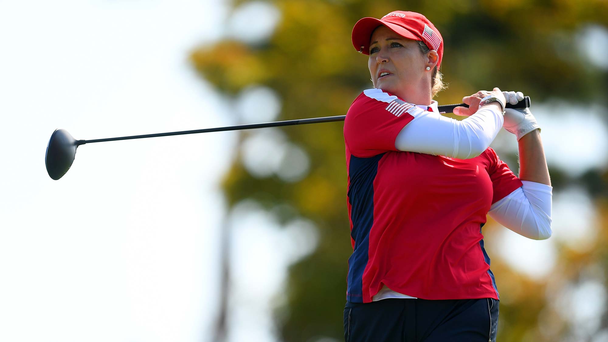 Cristie Kerr of the United States hits a tee shot on the 9th hole during the Singles match against Georgia Hall of England on day four of the UL International Crown