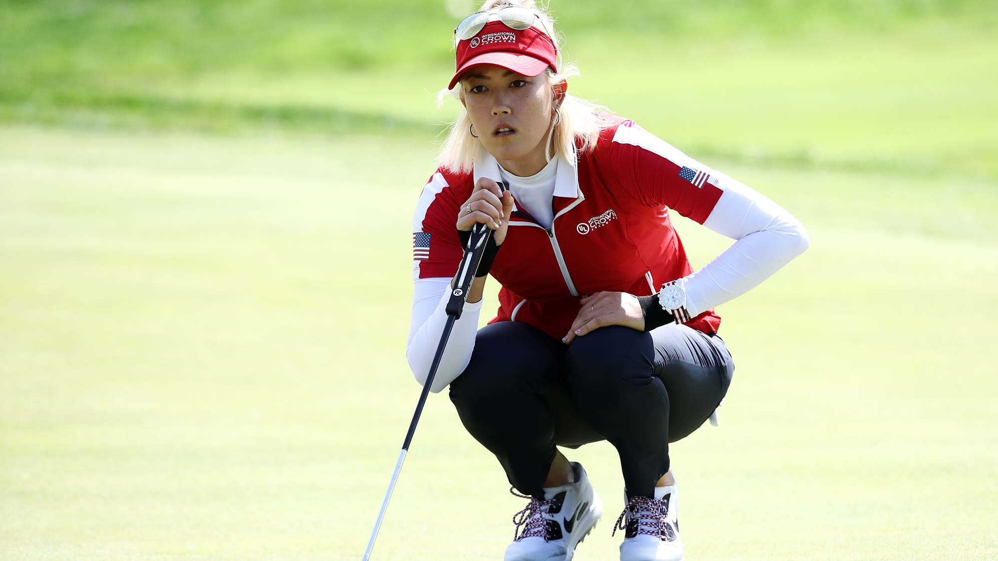 Michelle Wie of the United States lines up for a putt on the 3rd green during the Singles match against Moriya Jutanugarn of Thailand on day four of the UL International Crown