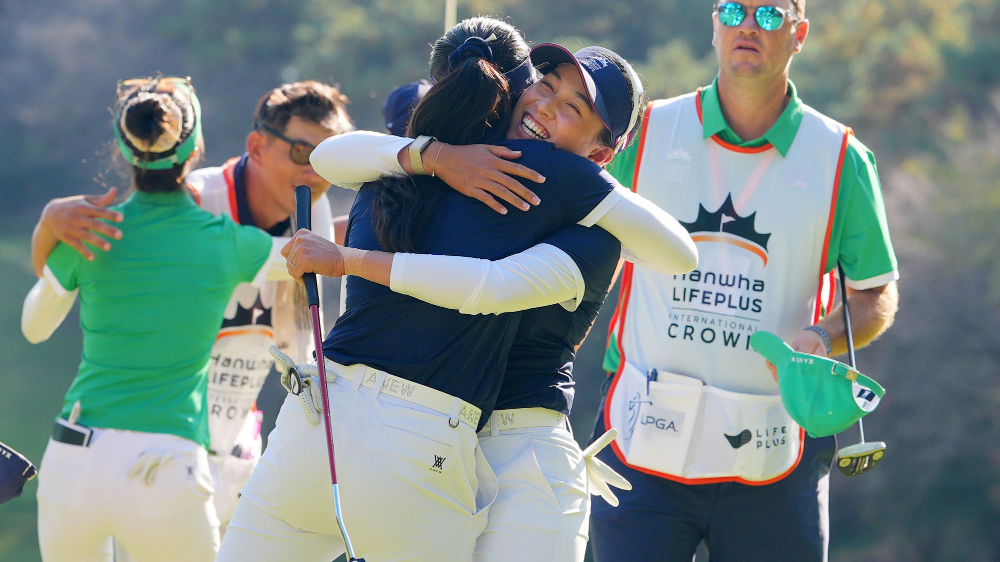 Pajaree Anannarukarn (L) and Jeeno Thitikul (R) of Thailand Team celebrate their 1up victory on the 18th green after the Pool A match against Australia Team during day one of the Hanwha LIFEPLUS International Crown 2025 at New Korea Country Club on October 23, 2025 in Goyang, South Korea.