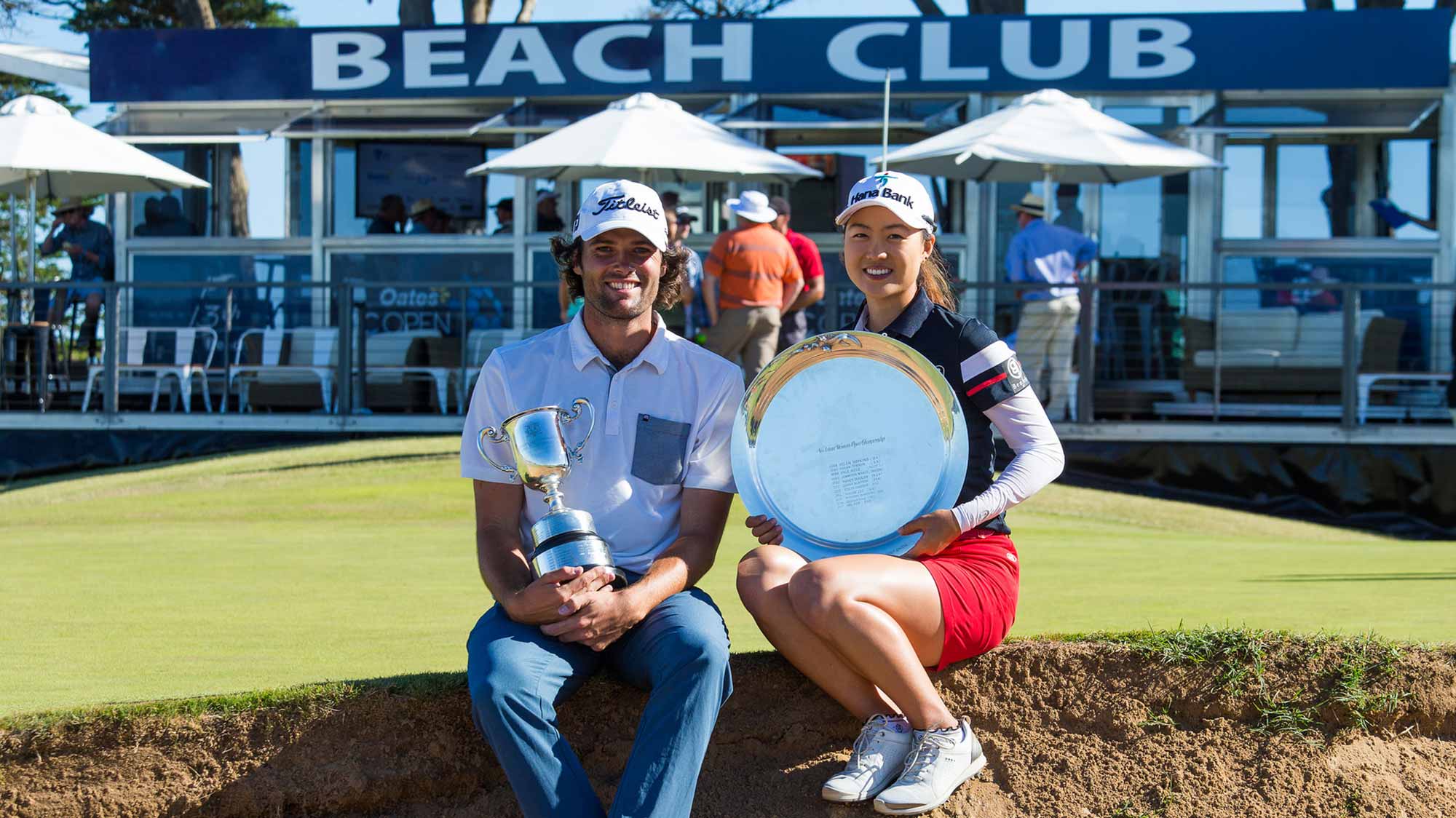 Minjee Lee and Simon Hawkes pose with their trophies after winning the 2018 Vic Open at Beach Golf Links in Geelong, Victoria, Australia