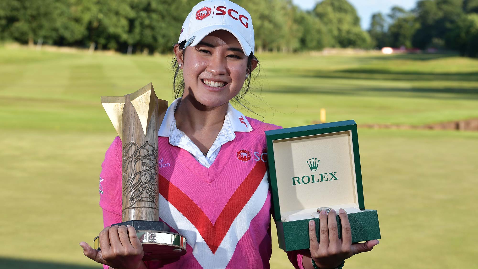 Pajaree Anannarukarn of Thailand poses with the trophy and a Rolex watch after her victory on the second playoff hole during the final round of the ISPS HANDA World Invitational