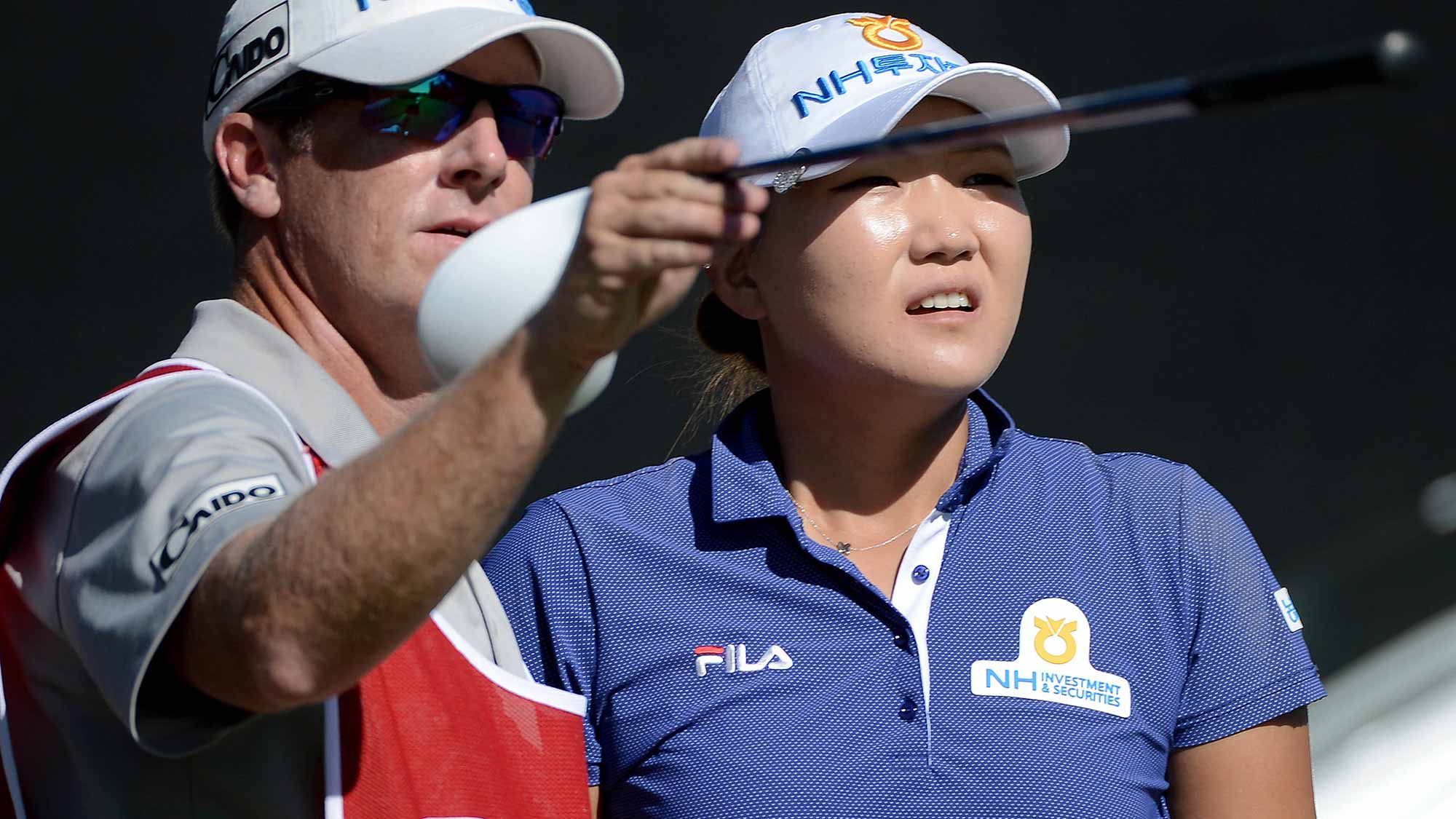 Mirim Lee of South Korea looks on with her caddie during Round One of the LPGA KIA Classic at the Aviara Golf Club on March 26, 2015 in Carlsbad, California