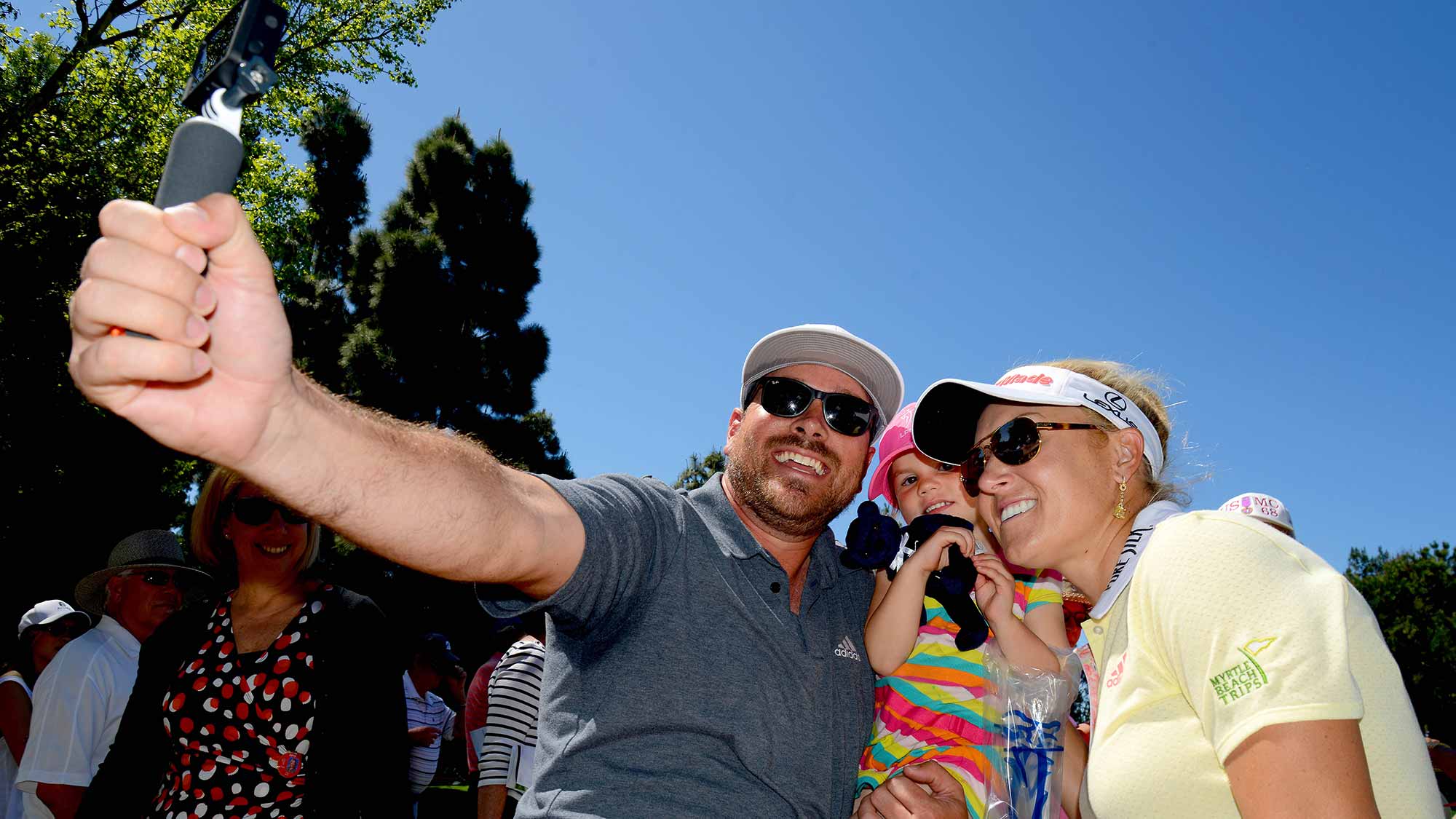 A fan does a selfie with Natalie Gulbis using a GoPro during Round Two of the LPGA KIA Classic at the Aviara Golf Club