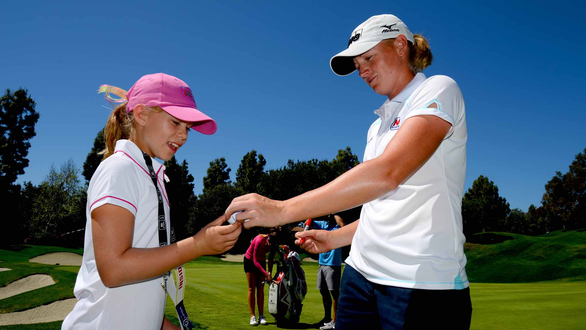 Stacy Lewis signs a ball for a fan during Round Two of the LPGA KIA Classic at the Aviara Golf Club