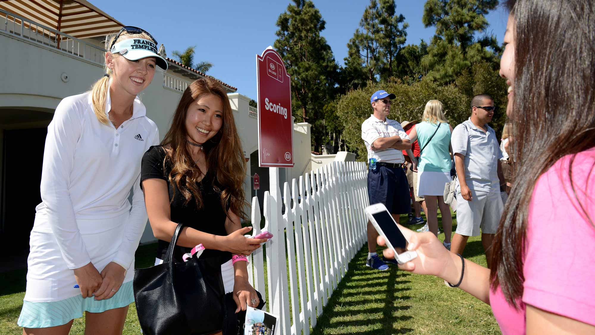 Jessica Korda poses for a photo with fans during Round Three of the LPGA KIA Classic at the Aviara Golf Club