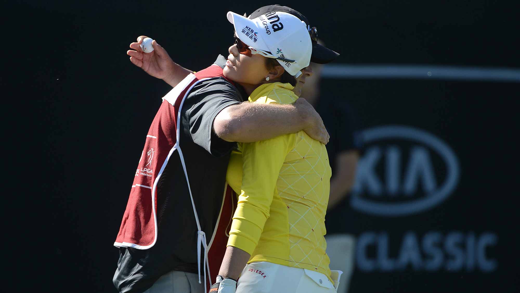 Se Ri Pak of South Korea hugs her caddie after holing the the ball off the green rough on the 18th green during Round Three of the LPGA KIA Classic at the Aviara Golf Club