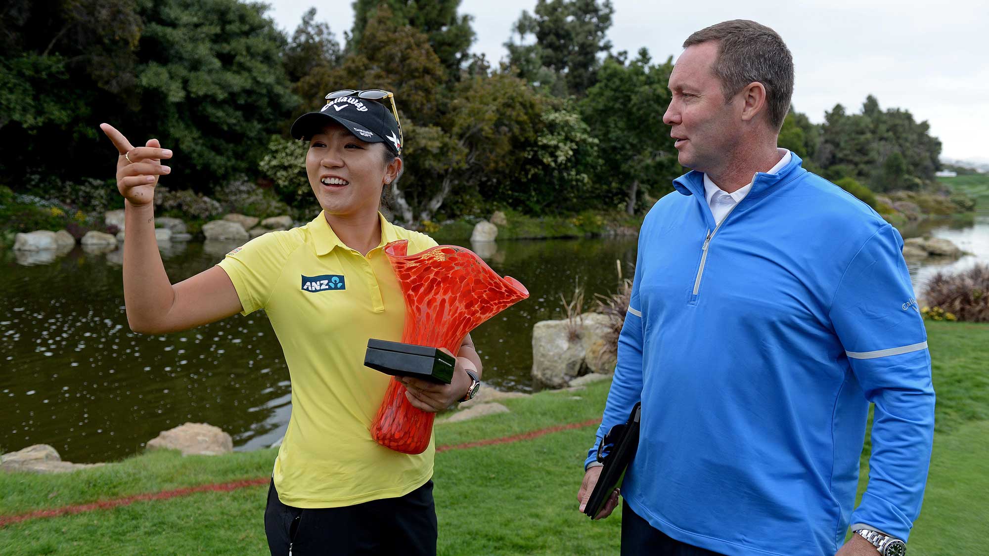 Lydia Ko of New Zealand speaks with LPGA Commissioner Michael Whan on the 18th hole after her -19 under victory during the final round of the KIA Classic