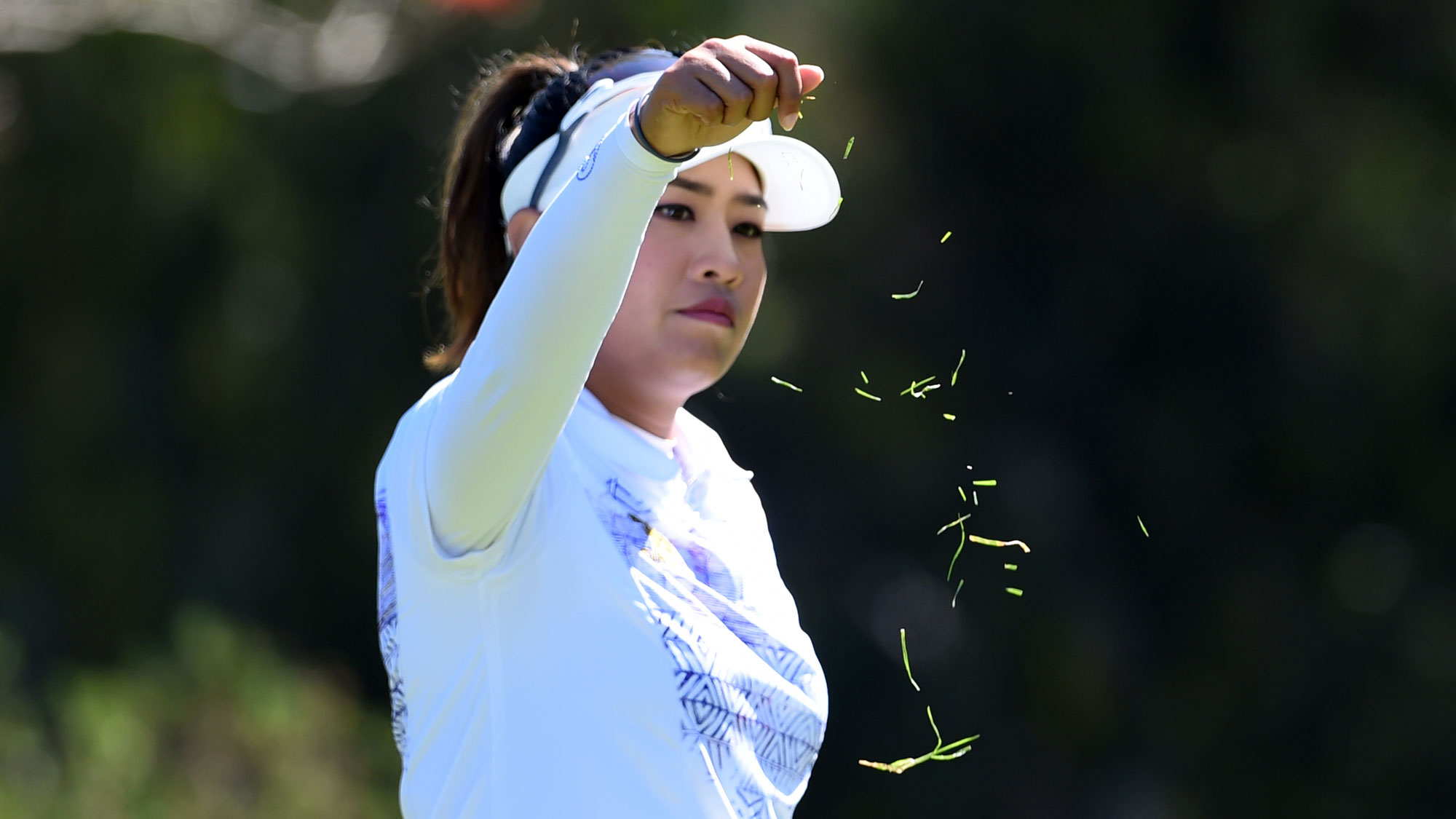 Thidapa Suwannapura of Thailand checks the wind before she hits her tee shot on the fourth hole during the third round of the Kia Classic