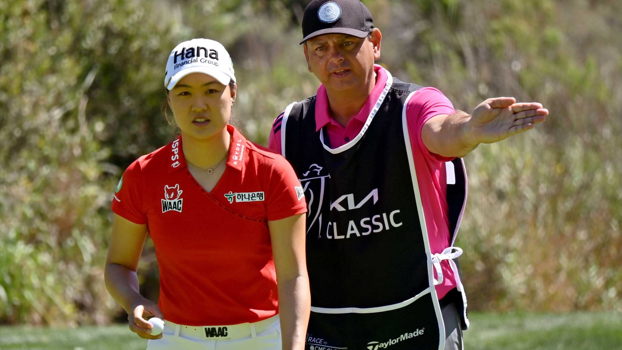 Minjee Lee of Australia lines up a putt with caddie on the 4th green during the Final Round of the KIA Classic at the Aviara Golf Club on March 28, 2021 in Carlsbad, California