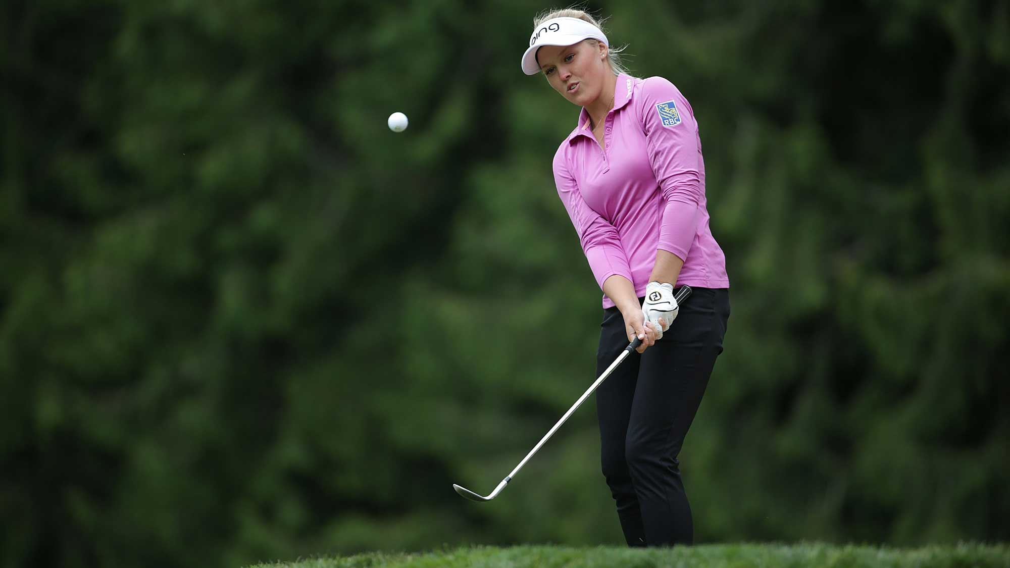 Brooke Henderson of Canada hits her first pitch shot to the sixth green dur...