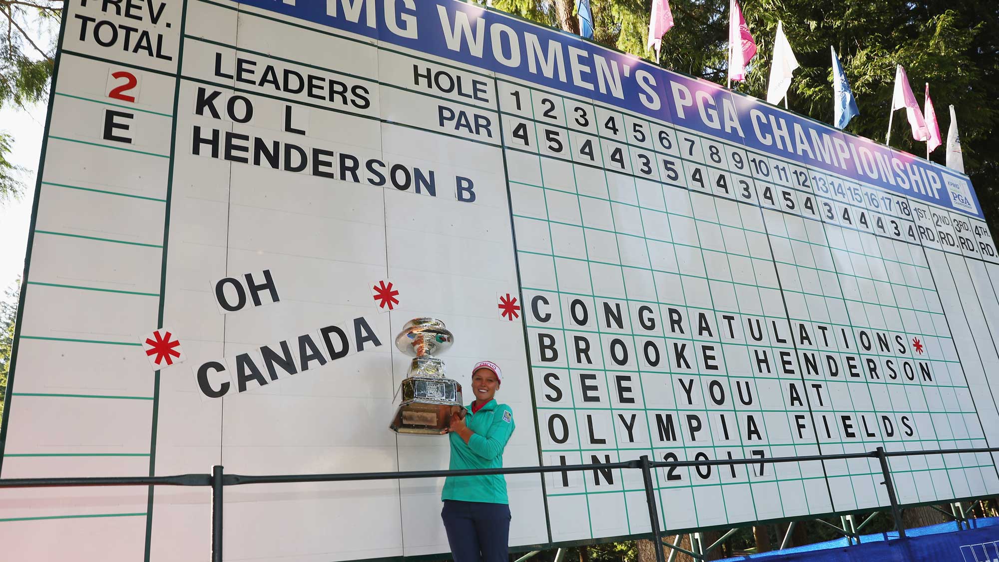 Brooke Henderson of Canada poses with the trophy after winning the KPMG Women's PGA Championship 