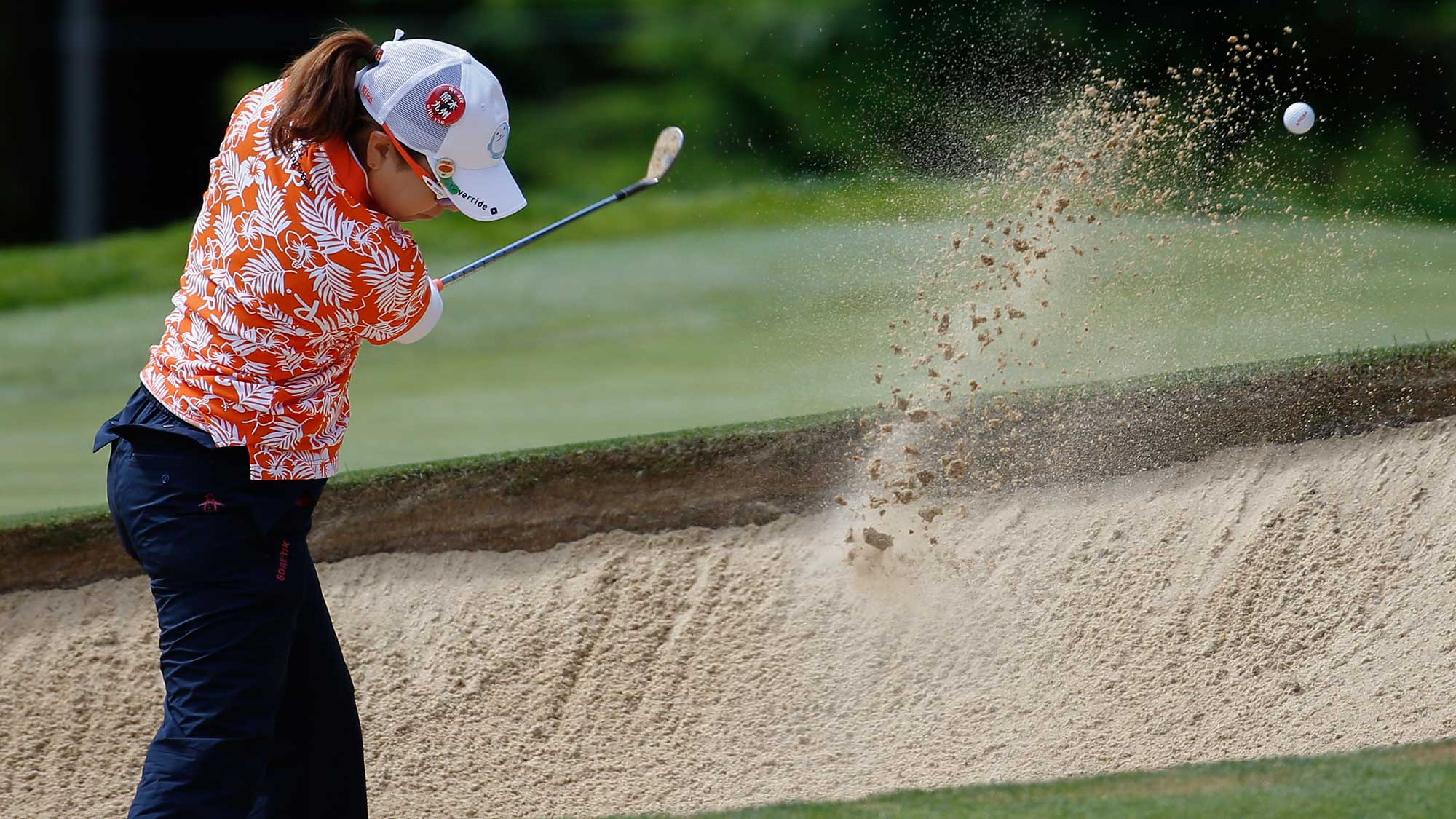 Mika Miyazato of Japan hits a bunker shot on the fifth hole during the final round of the KPMG Women's PGA Championship