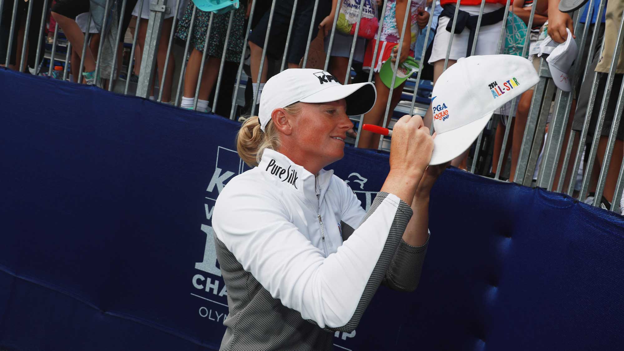 Stacy Lewis signs an autograph for a fan during a skills challenge prior to the start of the 2017 KPMG Women's PGA Championship