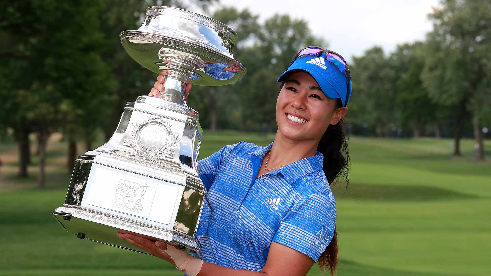 Danielle Kang poses with the championship trophy after winning the 2017 KPMG PGA Championship at Olympia Fields Country Club