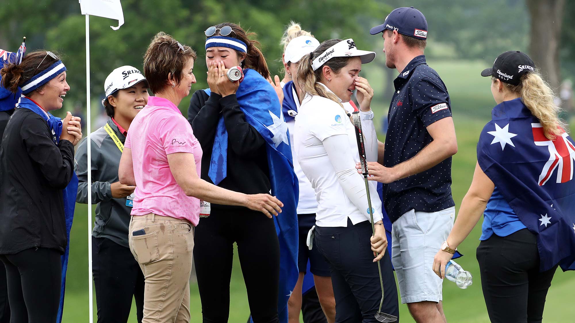 Hannah Green of Australia is swarmed by friends on the green after winning the KPMG Women's PGA Championship at Hazeltine National Golf Course 