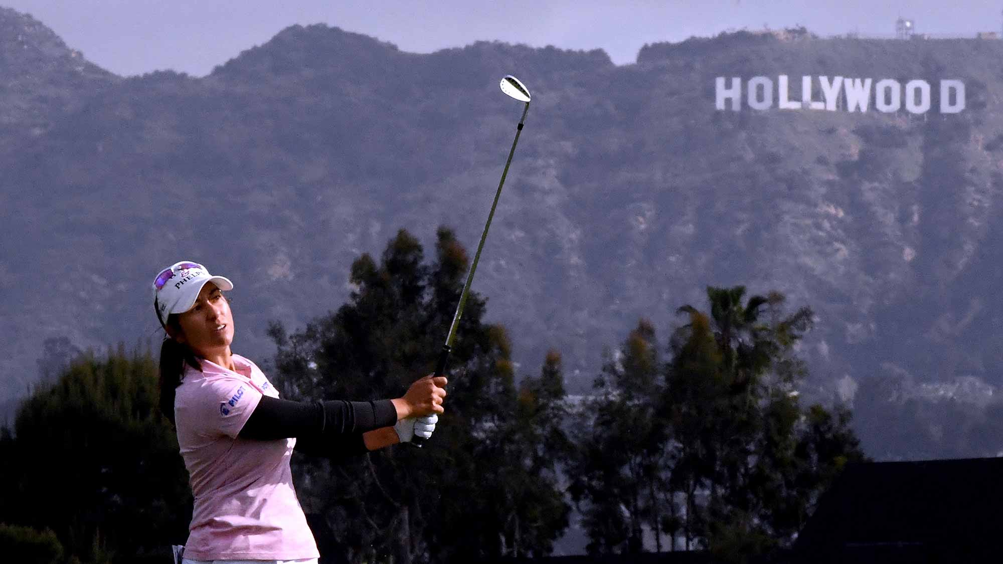 Marina Alex plays a wedge in front of the Hollywood sign during round two of the Hugel-JTBC LA Open at the Wilshire Country Club on April 20, 2018 in Los Angeles, California