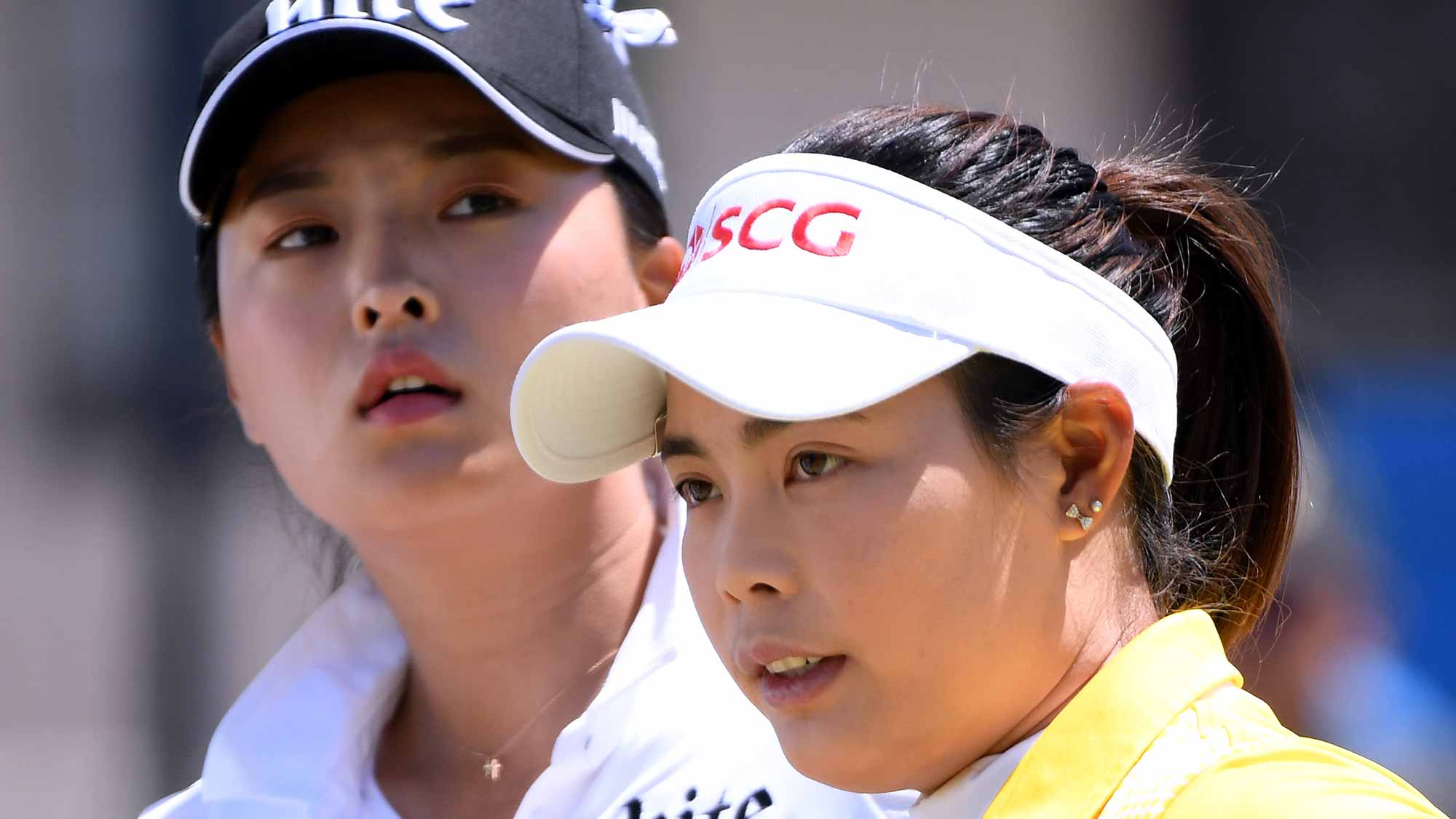 Moriya Jutanugarn of Thailand and Jin Young Ko of South Korea wait to tee off on the first hole during round four of the Hugel-JTBC LA Open at the Wilshire Country Club on April 22, 2018 in Los Angeles, California