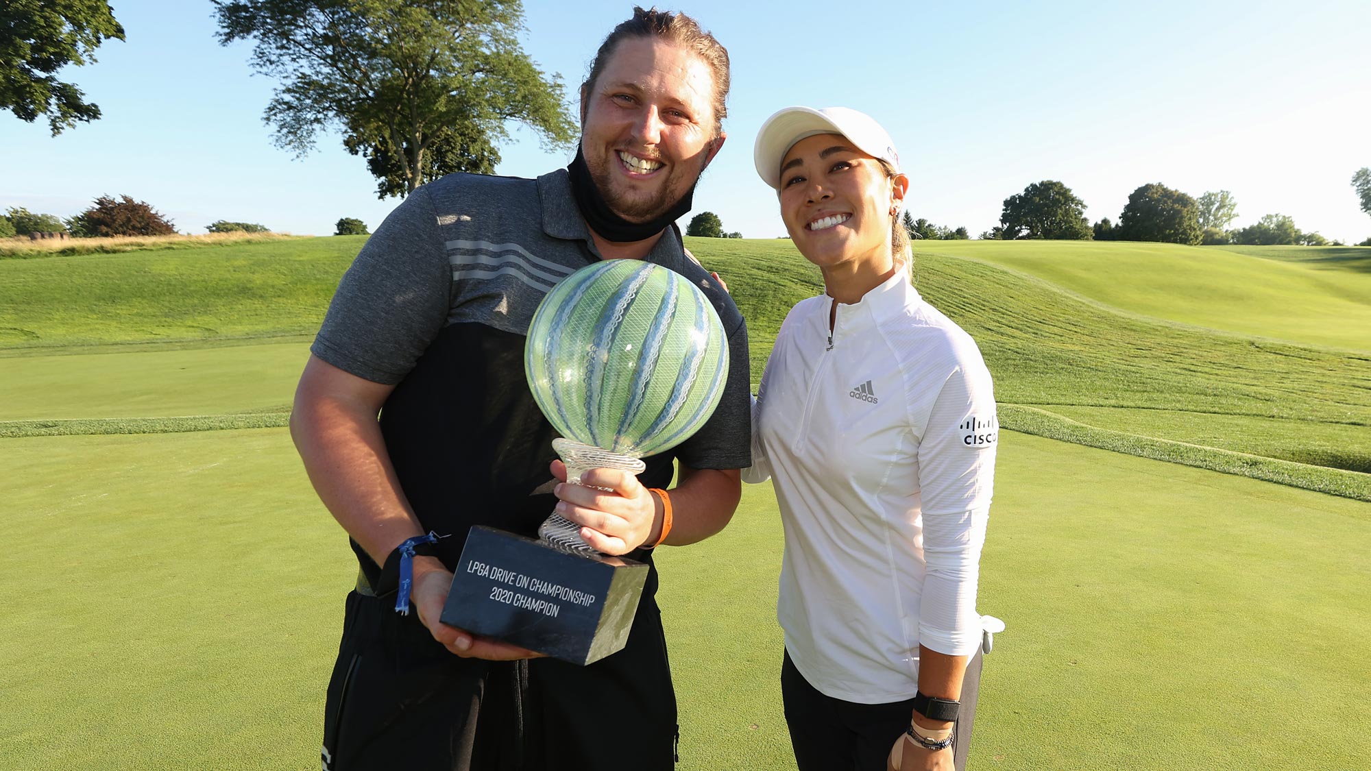 Danielle Kang celebrates with her caddie, Oliver Brett, after her -7 under par final round victory in the LPGA Drive On Championship