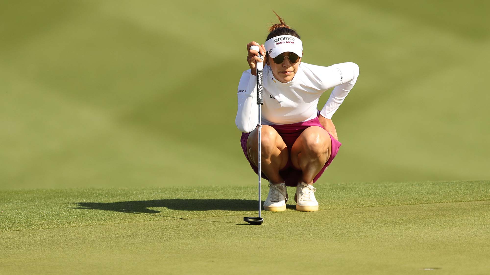 Alison Lee of the United States lines up her putt on the 11th green during the third round of the LPGA Drive On Championship