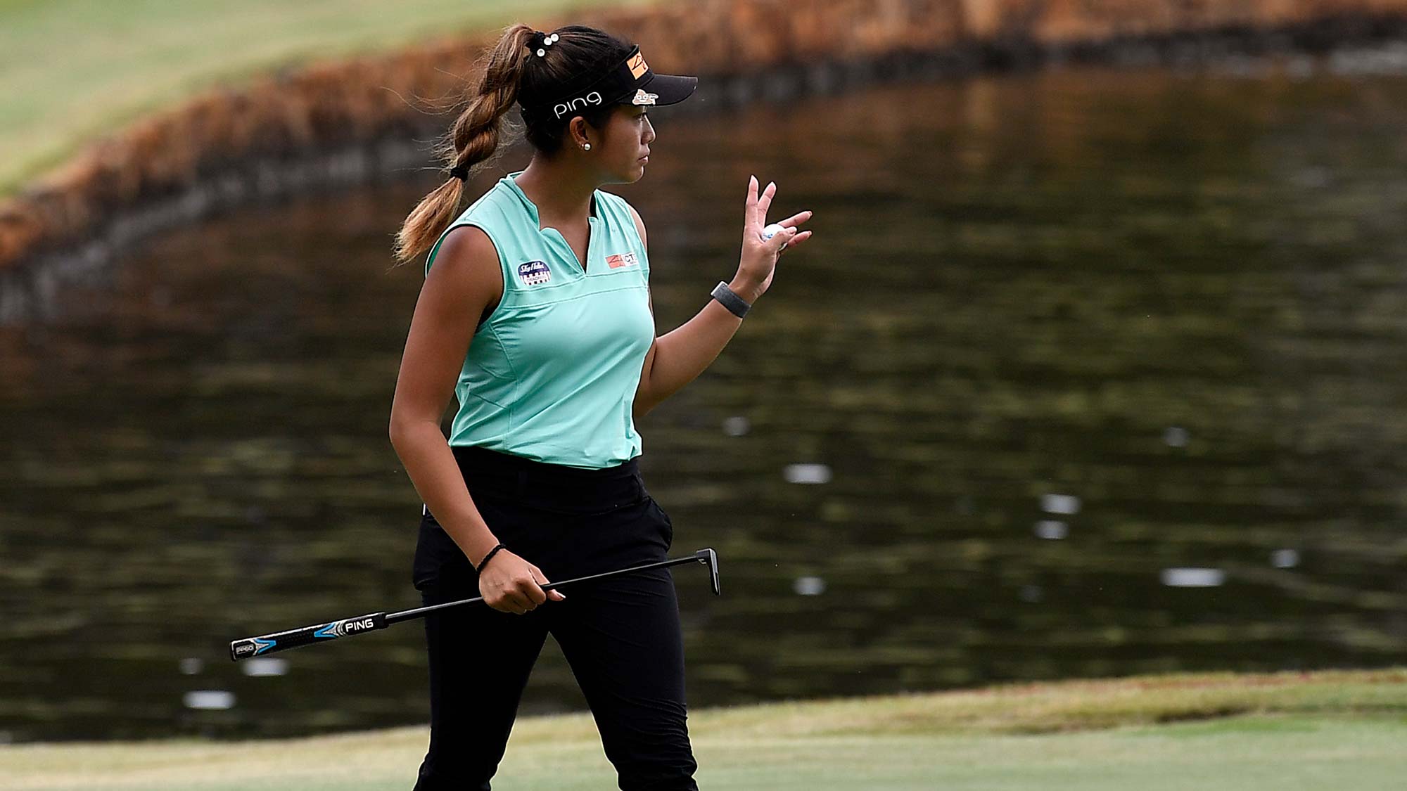 Bianca Pagdanganan waves to spectators as she walks off the 18th green during round three of the 2020 LPGA Drive On Championship - Reynolds Lake Oconee