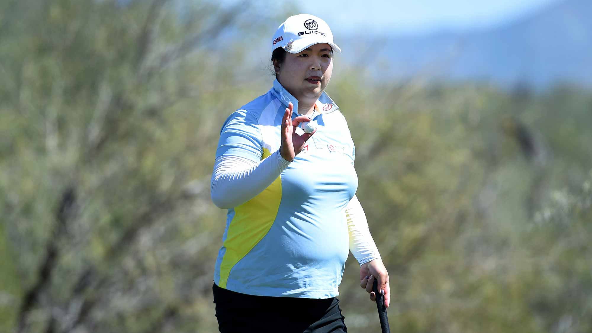 Shanshan Feng of China acknowledges the gallery after sinking a putt on the 16th hole during the third round of the Bank Of Hope Founders Cup at the Wildfire Golf Club on March 23, 2019 in Phoenix, Arizona