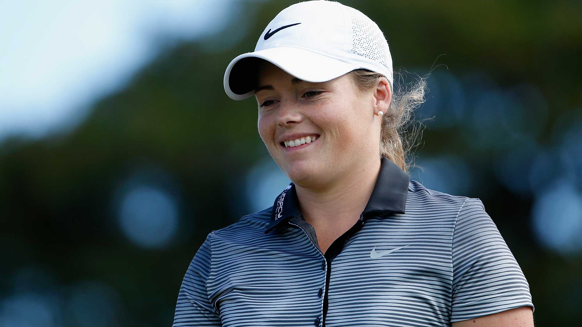 Katie Burnett smiles after her tee shot on the ninth hole during the second round of the LPGA LOTTE Championship 