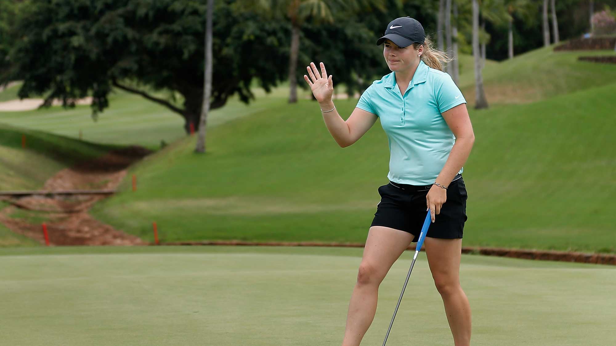 Katie Burnett reacts to a par putt on the fourth green during the final round of the LPGA LOTTE Championship 