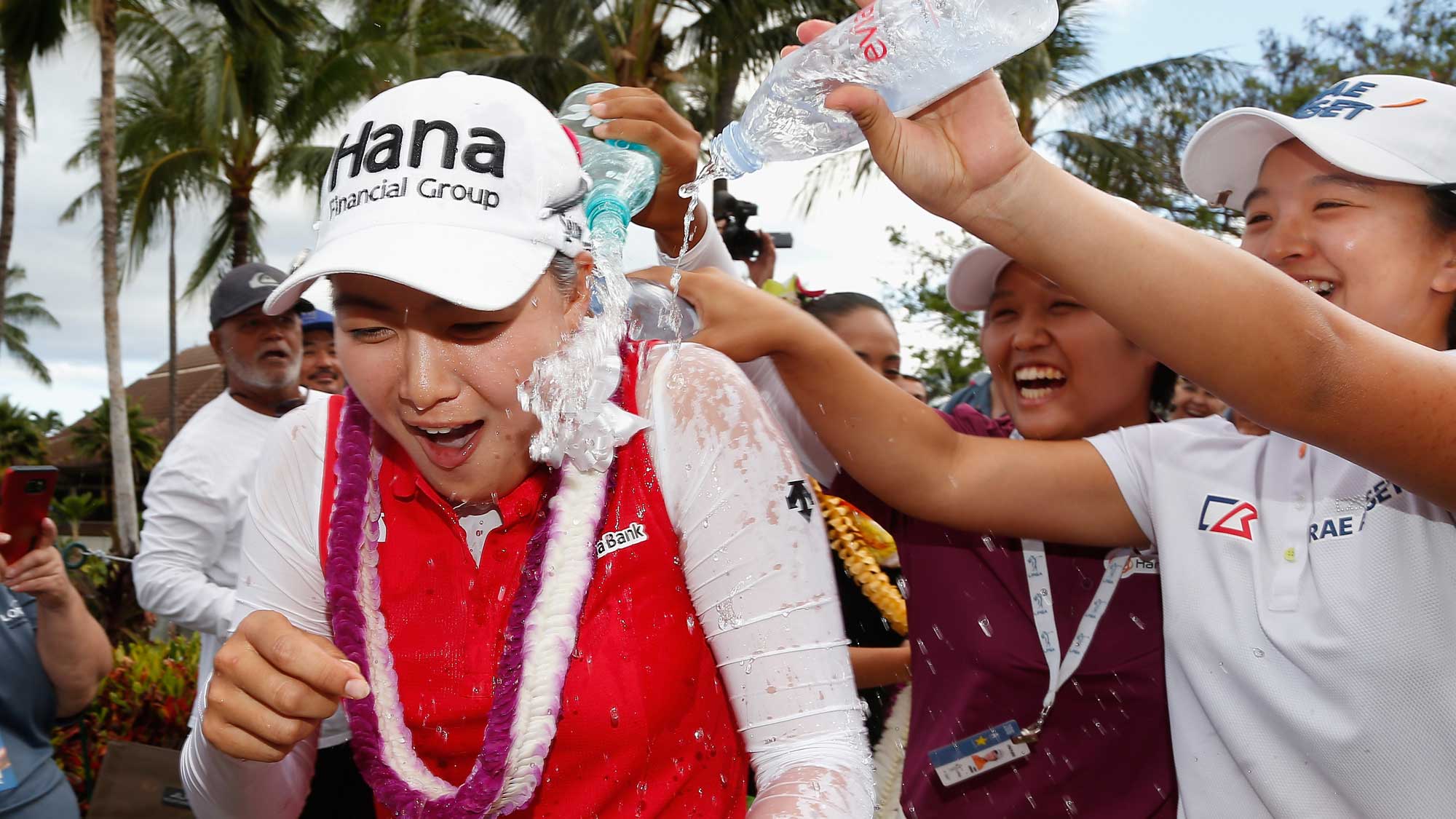 Minjee Lee (L) of Australia has water dumped on her by Haru Nomura (C) of Japan and Sei Young Kim (R) of South Korea after Minjee won the LPGA LOTTE Championship Presented By Hershey