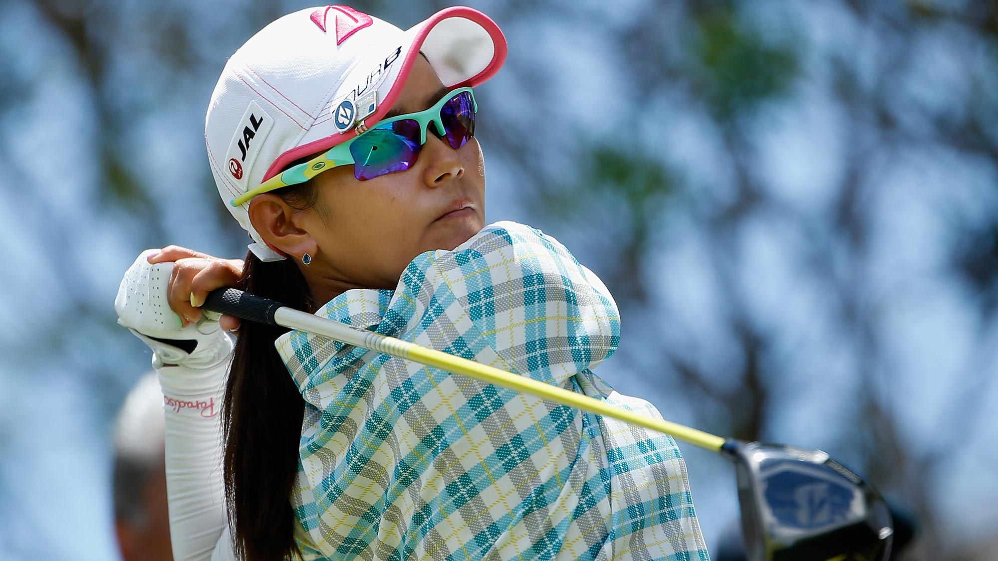 Ai Miyazato of Japan plays a tee shot on the fourth hole during the third round of the LPGA LOTTE Championship 