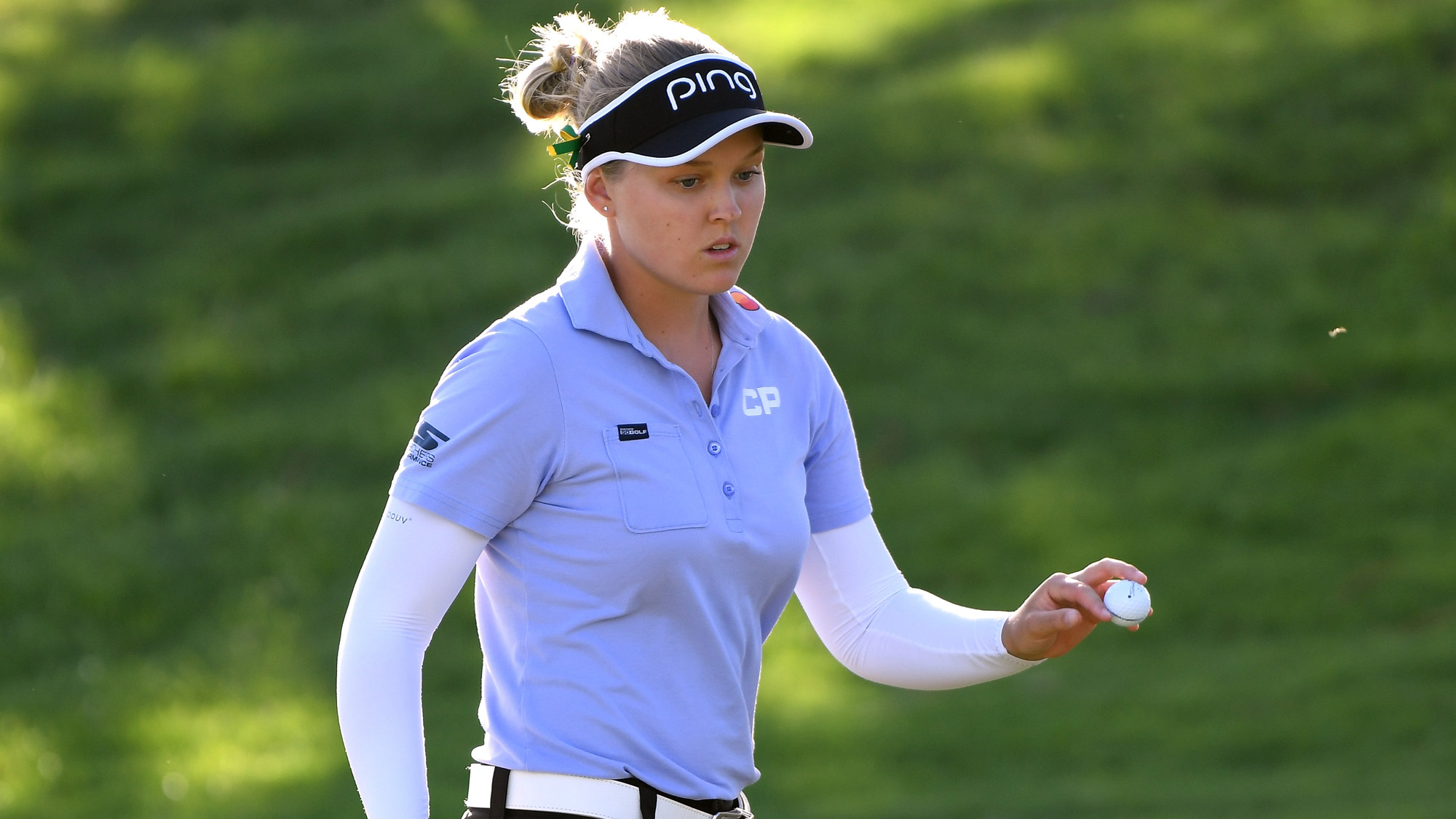 Brooke Henderson After Finishing a Putt in Hawaii