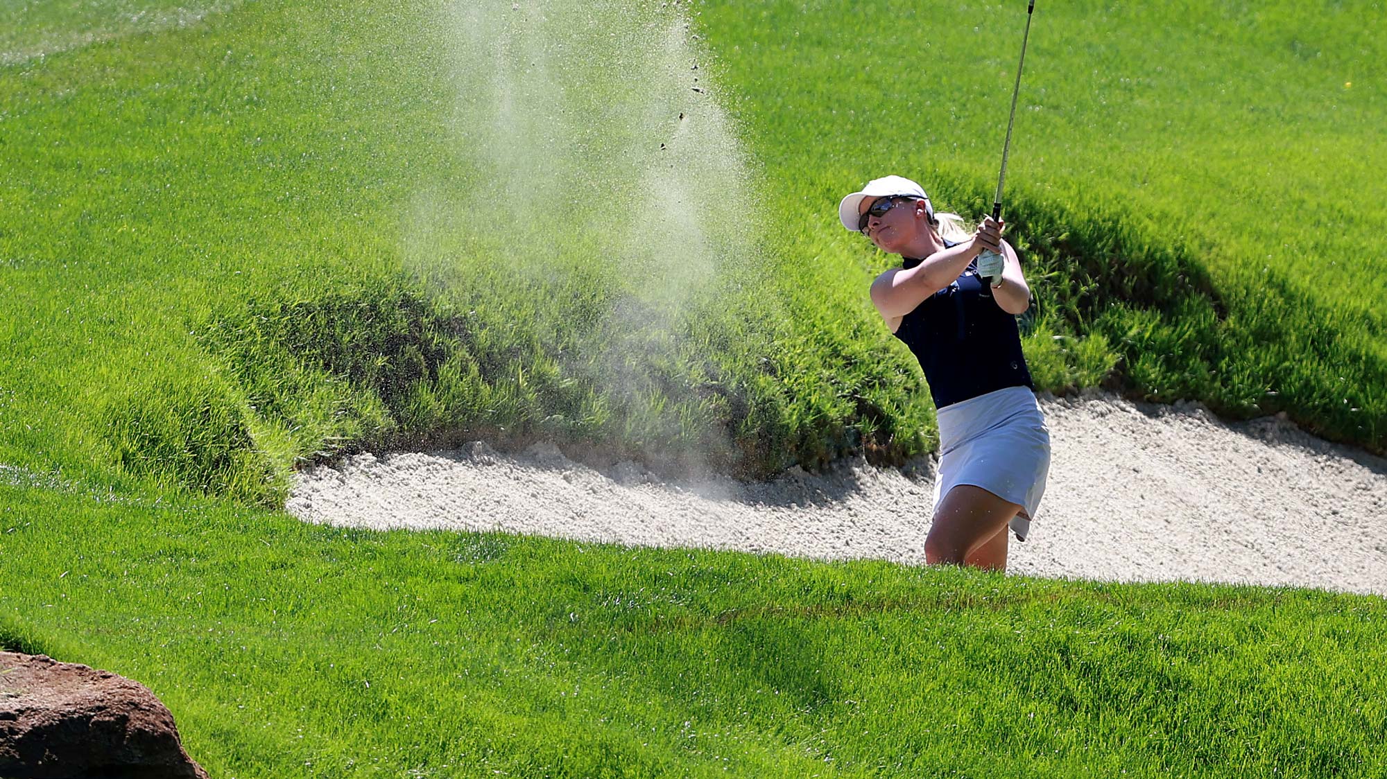 Jodi Ewart Shadoff of Great Britain hits out of a fairway bunker at the first fairway during the Bank of Hope LPGA Match-Play Hosted by Shadow Creek