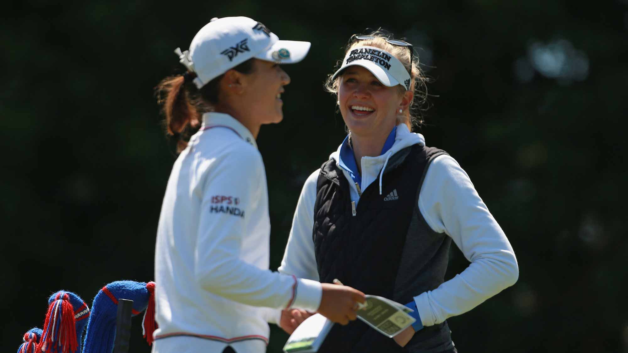 Lydia Ko of New Zealand and Jessica Korda (R) talk on the third hole during the final round of the LPGA MEDIHEAL Championship at Lake Merced Golf Club on April 29, 2018 in Daly City, California