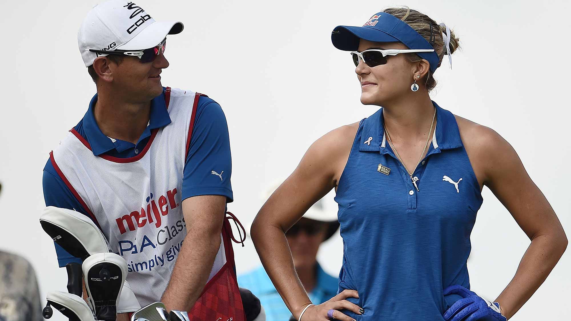 Lexi Thompson speaks with her caddie on the 15th tee during the first round of the Meijer LPGA Classic at Blythefield Country Club
