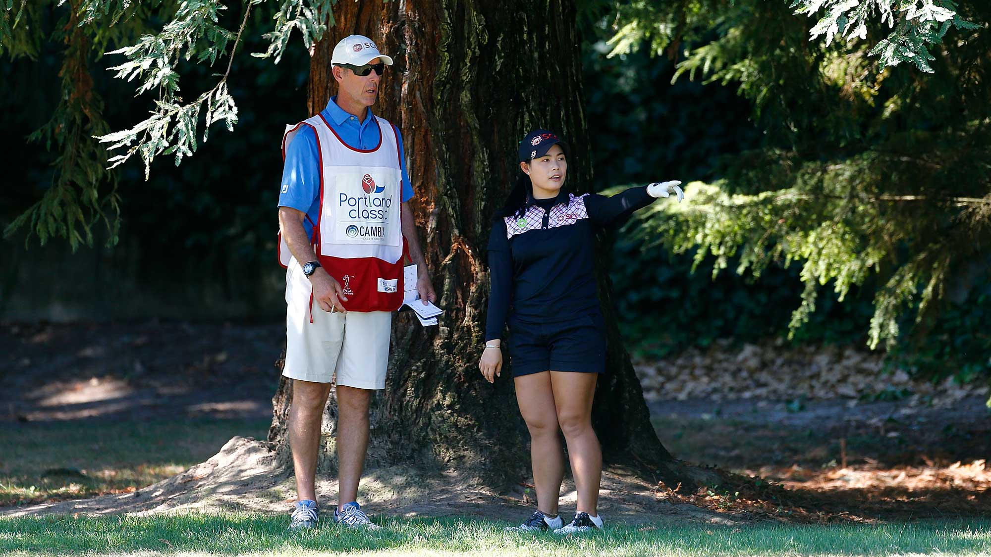 Moriya Jutanugarn of Thailand talks to her caddie on the 9th hole during the third round of the LPGA Cambia Portland Classic