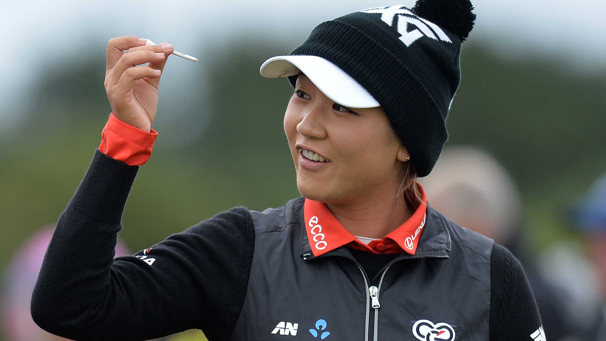 Lydia Ko of New Zealand takes a tee from her hair at the 1st hole during the first day of the Aberdeen Asset Management Ladies Scottish Open at Dundonald Links Golf Course
