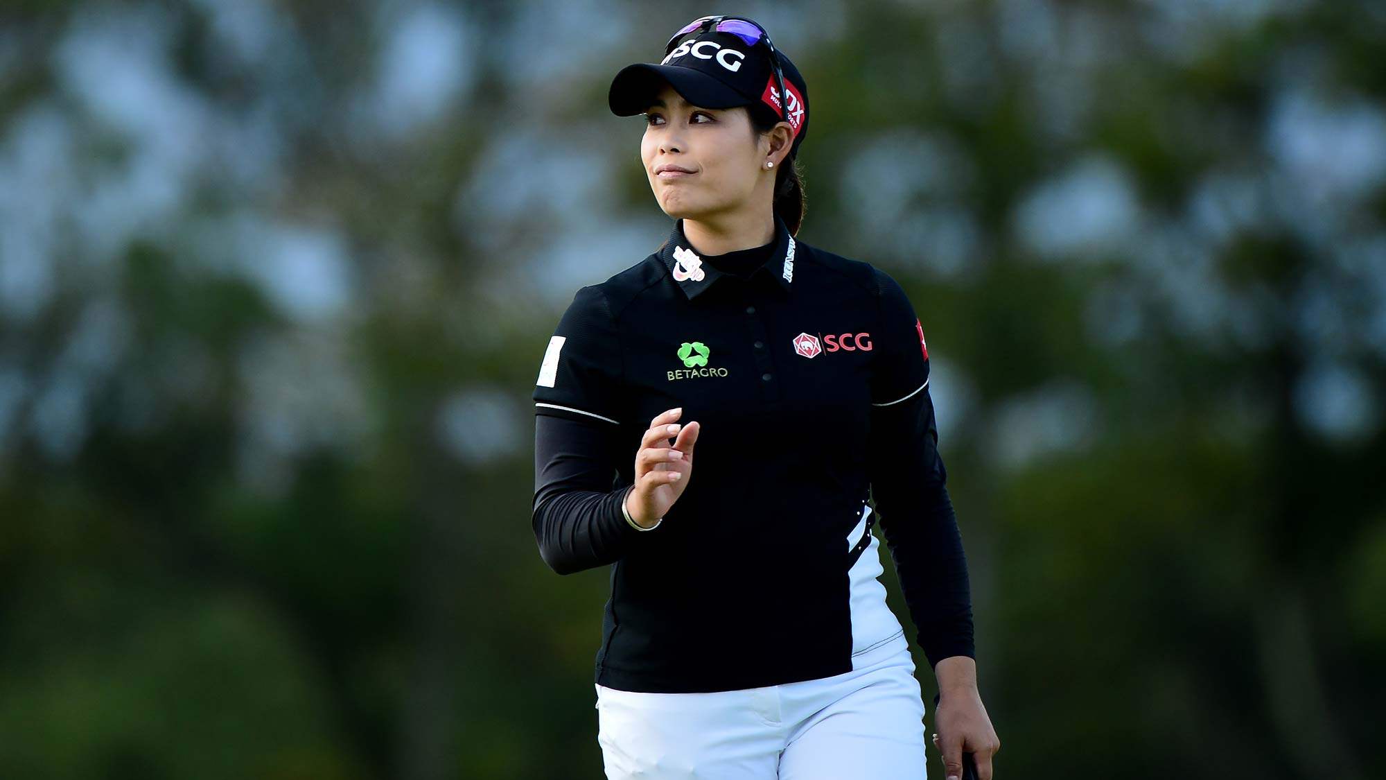 Moriya Jutanugarm of Thailand waves at the 18th hole during the Aberdeen Standard Investment Scottish Open