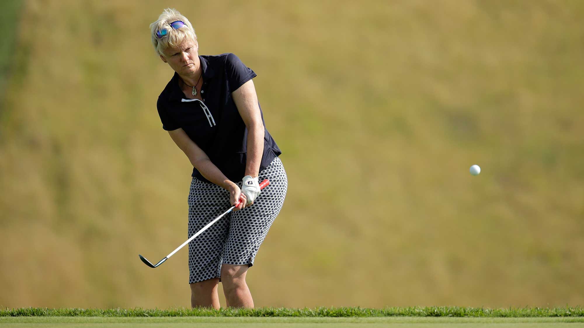 Trish Johnson of Great Britain hits her third shot on the 18th hole during round one of the Senior LPGA Championship