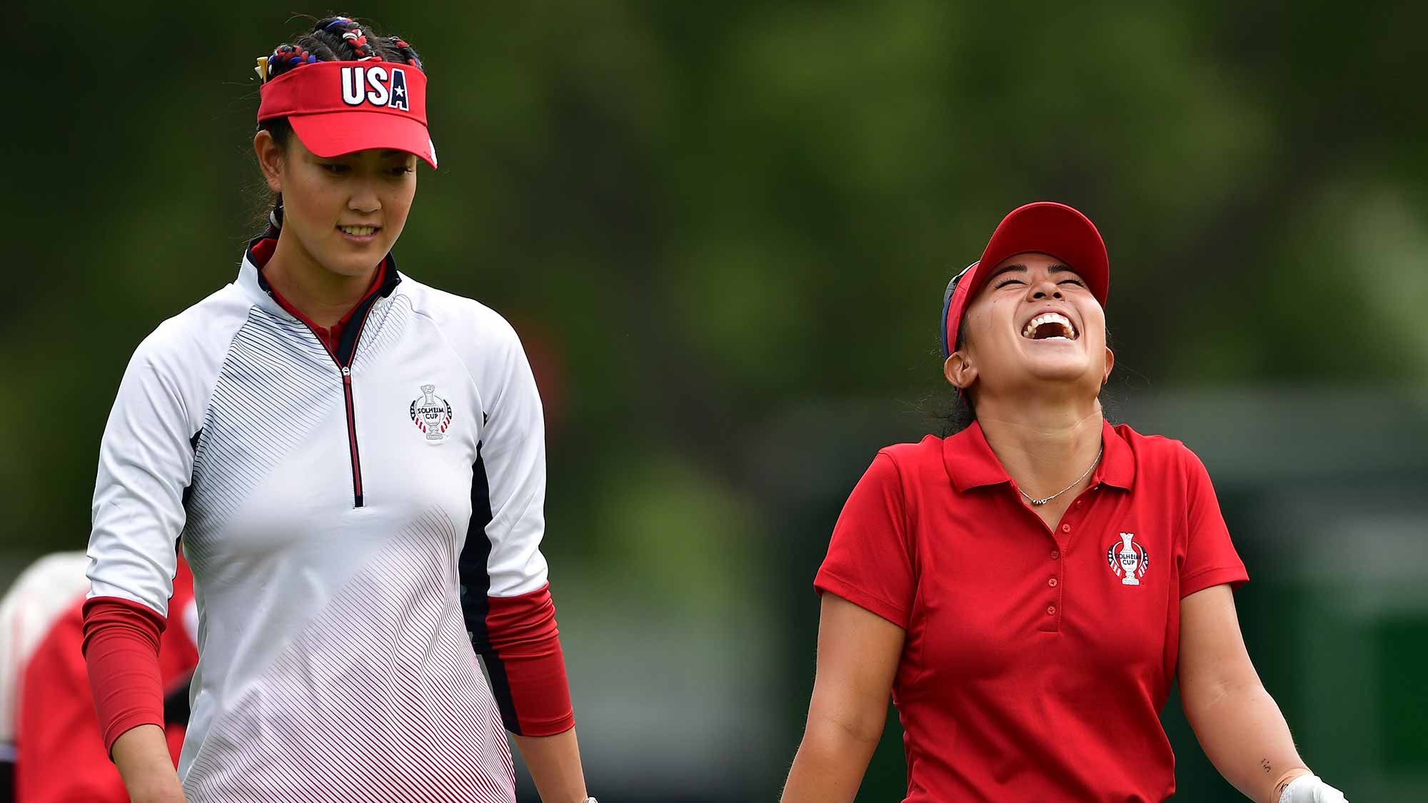 Michelle Wie and Danielle Kang of Team USA share a joke during practice for The Solheim Cup at the Des Moines Country Club