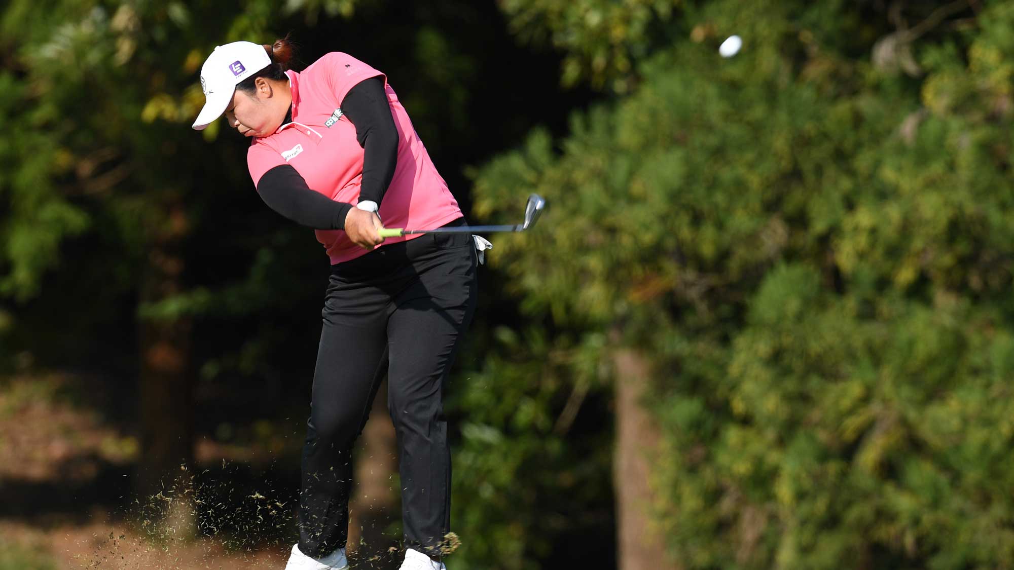 Shanshan Feng of China hits her second shot on the 14th hole during the final round of the TOTO Japan Classic