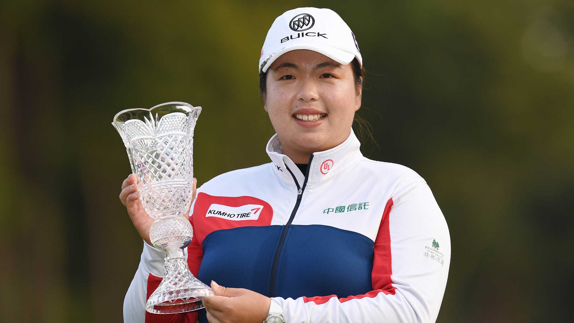 Shanshan Feng of China poses with the trophy after winning the TOTO Japan Classic