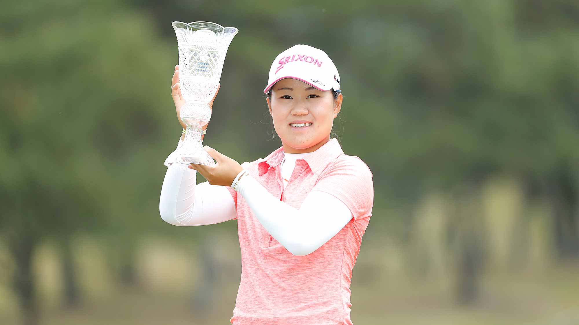 Nasa Hataoka of Japan holds the winner's trophy after winning the TOTO Japan Classic at Seta Golf Course on November 04, 2018 in Otsu, Shiga, Japan