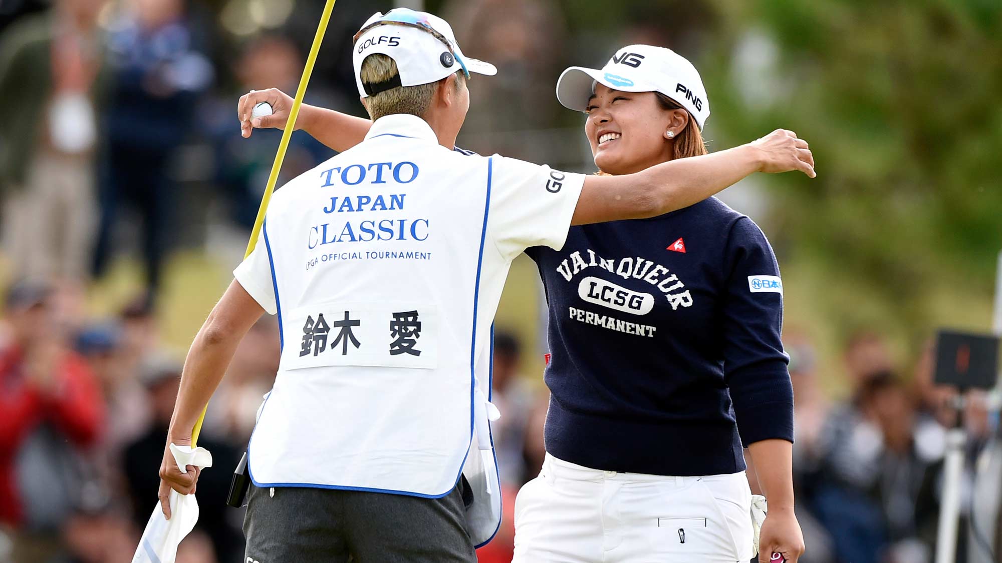 Ai Suzuki hugs caddy after winning TOTO Japan Classic